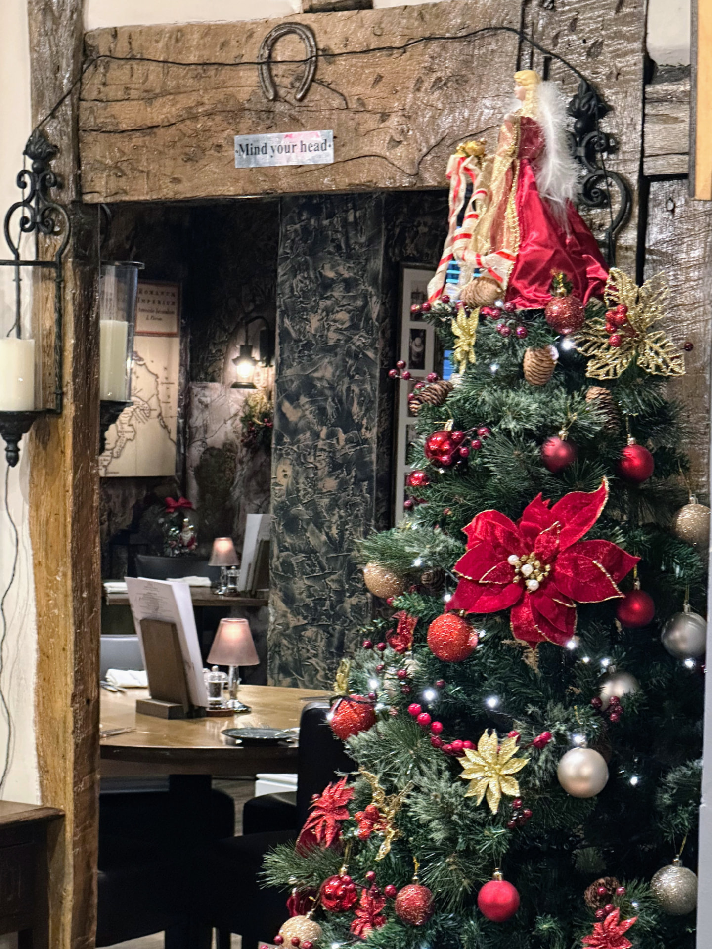 Caravelli Christmas tree beside the historic fireplace
